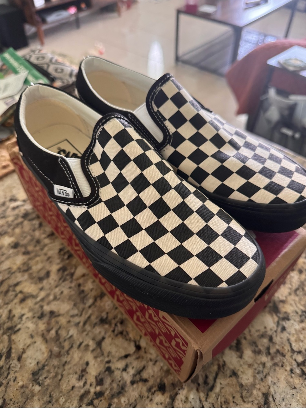 Women’s slip on checker boards black/white with black soles size 8.0